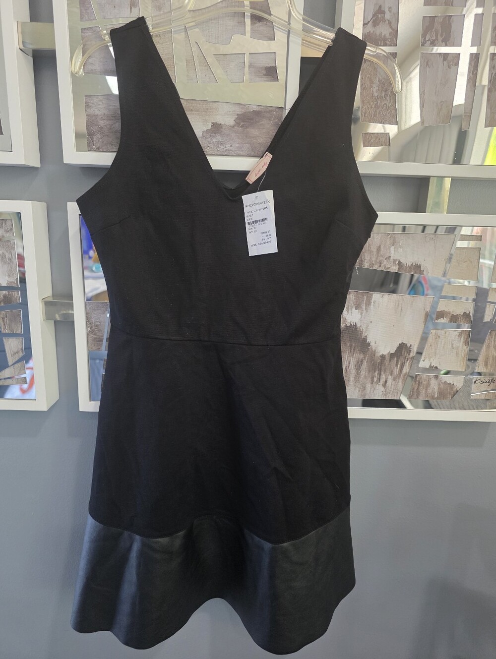 Black V-Neck Sleeveless Dress with Faux Leather Hem